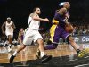 Los Angeles Lakers' Bryant drives past Brooklyn Nets' Williams during the first quarter of their NBA basketball game in Brooklyn, New York