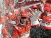 Kevin Harvick celebrates in the victory lane with his crew after winning the first NASCAR Sprint Cup Series Budweiser Duel at the Daytona International Speedway in Daytona Beach