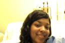 In this Oct. 21, 2014 photo provided by Amber Vinson, shows Vinson at Emory University Hospital in Atlanta. Officials at Emory University Hospital and the Centers for Disease Control and Prevention couldn't detect Ebola in Amber Vinson as of Tuesday evening, her family said in a statement released through a media consultant. (AP Photo/Amber Vinson)