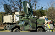 Two styles of US Marine Corps trucks are seen carrying the Active Denial System, March 9th, 2012, at the US Marine Corps Base Quantico, Virginia. The non-lethal weapon projects a strong electromagnetic beam up to 1000-meters. The beam creates heat so uncomfortable the natural response is to flee (AFP Photo/Paul J. Richards)