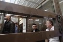 Defendants in the murder trial of Russian journalist and human rights activist Anna Politkovskaya attend a court hearing in Moscow