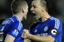 Captain John Terry, right, congratulates Andre Schurrle after he scored Chelse'a third goal against Derby during the Quarter Final of the English League Cup soccer match between Derby County and Chelsea at the iPro Stadium, Derby, England, Tuesday, Dec. 16, 2014. (AP Photo/Rui Vieira)