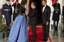 First lady Michelle Obama, left, and President Barack Obama welcome French President François Hollande for a State Dinner at the North Portico of the White House on Tuesday, Feb. 11, 2014, in Washington.(AP Photo/ Evan Vucci)
