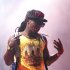 FILE - In this June 11, 2011 file photo, Lil Wayne performs during the Bonnaroo Music and Arts Festival in Manchester, Tenn. Lil Wayne said Monday, Aug. 22, 2011, he is recovering after gashing his head at a St. Louis-area skateboard park. The 28-year-old rapper whose real name is Dwayne Michael Carter Jr. was in suburban St. Louis Sunday for a performance at the outdoor Verizon Amphitheatre. (AP Photo/Dave Martin, file)
