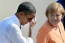 File picture taken on June 19, 2013 shows US President Barack Obama wiping his brow as he and German Chancellor Angela Merkel leave the stage after his speech at the Brandenburg Gate in Berlin