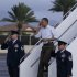 President Barack Obama salutes as he steps off of Air Force One at Hickam Air Force Base in Friday, Dec. 23, 2011, in Honolulu. (AP Photo/Carolyn Kaster)
