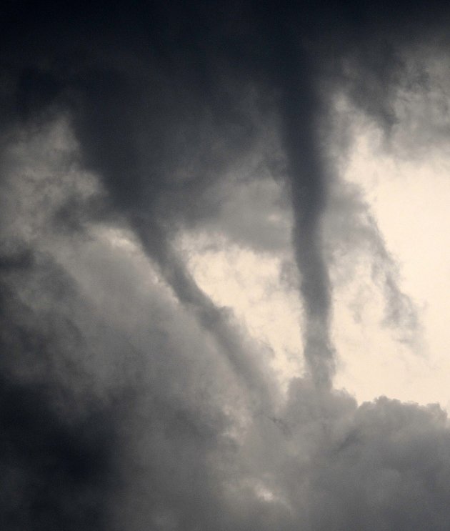 Two funnel clouds are seen over Moundridge