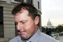 FILE - In this July 6, 2011 file photo, the Capitol is seen in the background, as former Major League Baseball pitcher Roger Clemens arrives at federal court in Washington. On a baseball field, players back up teammates to limit the damage from errors. The Justice Department, embarrassed by an error that caused a mistrial of Roger Clemens last year, has added more prosecutors in hopes of containing any missteps as it seeks to convict the famed pitcher of lying to Congress when he said he never used performance-enhancing drugs. (AP Photo/Cliff Owen, File)