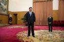 File photo of Xi Jinping waiting to greet former U.S. President Jimmy Carter in room 202 of the Zhongnanhai leadership compound in Beijing