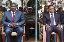 Central African Republic's new President Michel Djotodia sits next to Prime Minister Nicolas Tiangaye at a rally in support of Djotodia in downtown Bangui