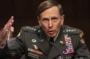General David Petraeus gestures during the Senate Intelligence Committee hearing in Washington