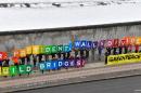 Activists from Greenpeace display a message reading "Mr President, walls divide. Build Bridges!" along the Berlin wall in Berlin on January 20, 2017 to coincide with the inauguration of Donald Trump as the 45th president of the United States