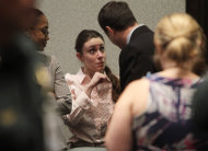 Casey Anthony talks with a supporter in court following the end of her murder trial where she was acquitted of murder charges in Orlando, Fla. Tuesday, July 5, 2011. Anthony had been charged with killing her daughter, Caylee. (AP Photo/Red Huber, Pool)