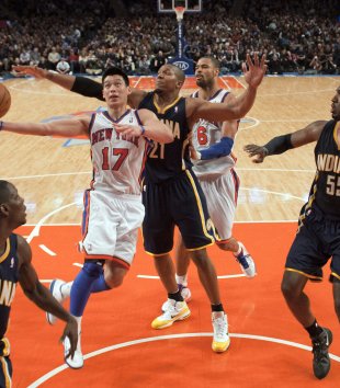 New York Knicks Lin drives past Indiana Pacers David West, Darren Collison and center Roy Hibbert in NBA game in New York