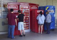 Customers rent DVD movies from a redbox video kiosk in Burbank, California,  May 8, 2011.  REUTERS/Fred Prouser