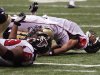 FILE - In this Oct. 21, 2007 file photo, Atlanta Falcons quarterback Byron Leftwich, top, screams in pain as he is bent backwards and injured on a sack by the New Orleans Saints  during the third quarter of an NFL game in New Orleans. Now that the NFL has uncovered a big-money bounty program for players in New Orleans, it likely will zero in on other teams Gregg Williams worked for. That means the Titans, Redskins, Jaguars and Bills probably should all expect to hear from the league soon.  (AP Photo/The Atlanta Journal and Constitution, Curtis Compton, File)  GWINNETT DAILY POST OUT, MARIETTA DAILY JOURNAL OUT