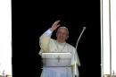Pope Francis delivers a speech from the window of his apartment during his Sunday Angelus prayer in Saint Peter's Square at the Vatican on September 7, 2014