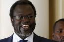 South Sudan's rebel leader Riek Machar smiles as he meets his friends at Sheraton Hotel in Addis Ababa