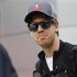 Red Bull F1 driver Vettel of Germany looks on as he arrives at the paddock ahead of the Malaysian F1 Grand Prix in Sepang