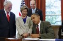 U.S. President Barack Obama signs the U.S.-Israel cooperation act in Washington