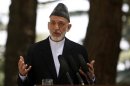 Afghan President Hamid Karzai speaks during a news conference in Kabul