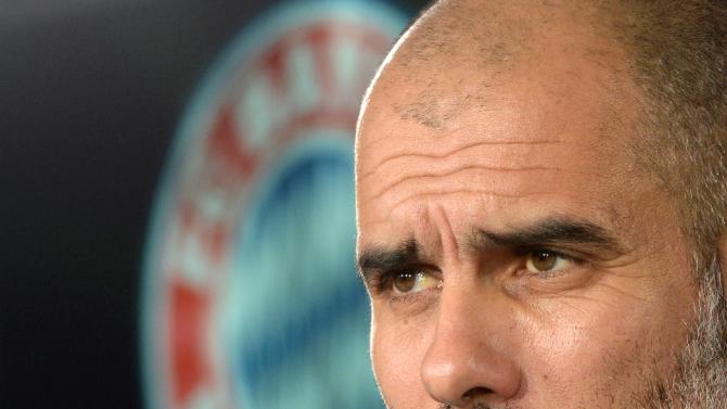 Bayern Munich's Spanish headcoach Pep Guardiola attends a press conference in Munich, Germany, on December 9, 2014