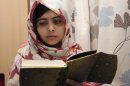 FILE - In this undated file photo provided by Queen Elizabeth Hospital in Birmingham, England, Malala Yousufzai, the 15-year-old girl who was shot at close range in the head by a Taliban gunman in Pakistan, reads a book as she continues her recovery at the hospital. Malala Yousafzai, the Pakistani teenager shot in the head by the Taliban, is writing a memoir. Publisher Weidenfeld and Nicolson said Thursday March 28, 2013 it will release "I am Malala" in Britain this fall. Little, Brown will publish it in the United States.A Taliban gunman shot Malala on Oct. 9, while she was on her way home from school in northwestern Pakistan. (AP Photo/Queen Elizabeth Hospital, File)