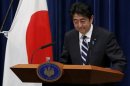 Japan's Prime Minister Shinzo Abe bows he leaves a news conference at his official residence in Tokyo