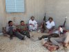 Rebel fighters from the Tripoli Brigade relax at their base close to the front line near the town of Tiji, western Libya, Monday, Aug. 1, 2011. The rebel fighters of the Tripoli Brigade have a single purpose - to be among the first to enter the Libyan capital and kick out Moammar Gadhafi and his loyalists, aided by their intimate knowledge of the city. (AP Photo/Balint Szlanko)