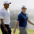 Tiger Woods, left, and Rory McIlroy, of Northern Ireland, walk up the fairway of the 17th hole during the first round at the Tour Championship golf tournament, Thursday, Sept. 20, 2012, in Atlanta. (AP Photo/David Goldman)
