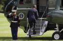 President Barack Obama boards Marine One on the South Lawn of the White House in Washington, Tuesday, Sept. 2, 2014, for a short trip to Andrews Air Force Base, Md., then onto Estonia for meetings with Baltic leaders then onto Wales for a NATO summit. (AP Photo/Evan Vucci)