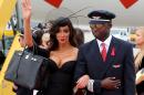 US model Yasmine Petty, left, arrives for the largest annual AIDS charity gala in Europe known as the Life Ball, at the Vienna International Airport near Schwechat, Austria, Friday, May 15, 2015. (AP Photo/Ronald Zak)