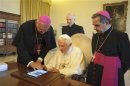 A file photo of Pope Benedict XVI using an iPad device at the Vatican