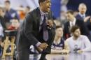 Connecticut head coach Kevin Ollie cheers his team against Florida during the second half of the NCAA Final Four tournament college basketball semifinal game Saturday, April 5, 2014, in Arlington, Texas. Connecticut won 63-53. (AP Photo/David J. Phillip)