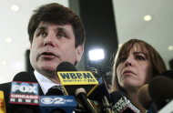 Former Illinois Gov. Rod Blagojevich speaks to the media at the Federal Courthouse Monday, June 27, 2011 in Chicago. Blagojevich has been convicted of 17 of the 20 charges against him, including all 11 charges related to his attempt to sell or trade President Barack Obama's vacated Senate seat. At right is his wife Patti. (AP Photo/Kiichiro Sato)