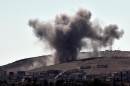 Smoke rises following an air strike on the eastern sector of the Syrian town of Kobane, on October 8, 2014