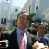 Republican presidential candidate, former Pennsylvania Sen. Rick Santorum, left, talks with reporters as he leaves La Fortaleza, or Fortess, where he met with the Commonwealth of Puerto Rico Governor Luis Fortuno, in San Juan, Puerto Rico, Wednesday March 14, 2012. (AP Photo/Dennis M. Rivera Pichardo)