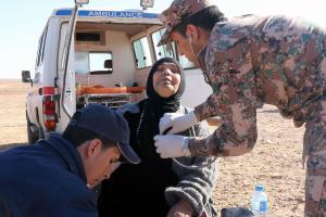 A Syrian woman receives medical attention after crossing &hellip;