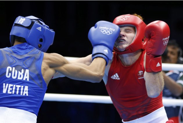 Australia's Ward fights against Cuba's Veitia Soto in the Men's Light Fly (49kg) Round of 32 boxing match during the London 2012 Olympic Games