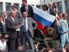 FILE - Boris Yeltsin, president of Russian Federation, left, reads a statement from atop a tank in Moscow in this  Aug. 19, 1991 file photo, as he urges the Russian people to resist a hardline takeover of the central government. Those who were by Yeltsin's side describe his decision to climb onto the tank as a stroke of political brilliance that proved crucial for the defeat of the coup. Among those with Yeltsin was his top adviser Gennady Burbulis, who recently spoke to The Associated Press about those days 20 years ago. (AP Photo/File)