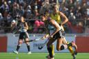 Argentina's Luciana Aymar (8) battles for the ball with Australia's Casey Eastham, right, during the Women's Champions Trophy field hockey final match in Mendoza, Argentina, Sunday, Dec. 7, 2014. (AP Photo/ Marcos Garcia)