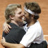 US Davis Cup team captain Jim Courier, left, celebrates with his player Mardy Fish after winning the double match against Swiss Davis Cup tennis players Roger Federer and Stanislas Wawrinka during the Davis Cup World Group first round double match between Switzerland and the US in the Forum Arena in Fribourg, Switzerland, Saturday, Feb. 11, 2012. (AP Photo/Keystone, Peter Klaunzer)