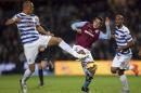 Queens Park Rangers' Bobby Zamora, left, and Aston Villa's Ashley Westwood in action during the English Premier League soccer match at Loftus Road in London, Monday Oct. 27, 2014. (AP Photo / John Walton, PA) UNITED KINGDOM OUT - NO SALES - NO ARCHIVES