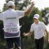Zach Johnson, right, celebrates with his caddie Damon Green after winning the PGA Colonial golf tournament following his final putt on the 18th hole, Sunday, May 27, 2012, in Fort Worth, Texas. (AP Photo/LM Otero)