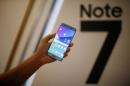 A model poses for photographs with a Galaxy Note 7 new smartphone during its launching ceremony in Seoul