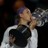 Victoria Azarenka of Belarus poses with The Daphne Akhurst Memorial Cup after defeating Li Na of China in their women's singles final match at the Australian Open tennis tournament in Melbourne