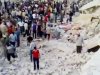 In this image made from amateur video released by the Ugarit News and accessed Wednesday, April 25, 2012, purports to show Syrians standing in rubble of damaged buildings from Syrian forces shelling in Hama, Syria. Syrian state media said Thursday that anti-regime bomb-makers accidentally set off blasts a day earlier that flattened parts of a residential area in the central city of Hama and killed several people. (AP Photo/Ugarit News via AP video) TV OUT, THE ASSOCIATED PRESS CANNOT INDEPENDENTLY VERIFY THE CONTENT, DATE, LOCATION OR AUTHENTICITY OF THIS MATERIAL