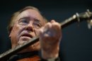 FILE - In this June 10, 2005 file photo, Earl Scruggs, performs at the Bonnaroo Music & Arts Festival in Manchester, Tenn. Scruggs' son Gary said his father passed away Wednesday morning, March 28, 2012 at a Nashville, Tenn., hospital of natural causes. He was 88. (AP Photo/Eric Parsons, File)