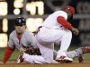 St. Louis Cardinals' Lance Berkman, left, steals second base past the tag from Philadelphia Phillies shortstop Jimmy Rollins during the second inning of a baseball game, Saturday, Sept. 17, 2011, in Philadelphia. (AP Photo/Matt Slocum)