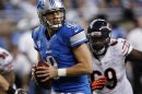 Detroit Lions' Stafford looks for his receiver while being pressured by the Chicago Bears defense during their NFL football game in Detroit